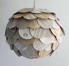 an ornament made out of books hanging from a hook