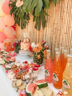 a table topped with lots of different types of food and drinks on top of it