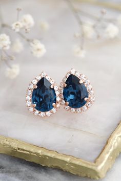 Blue Navy Bridal Earrings: Handset with exquisite Austrian crystals, our dark blue pear stud earrings are perfect for bridesmaids and special occasions. Details :  ● Materials- Gold Or Silver Plated Over Brass,  Genuine Austrian Premium Quality Crystals ● Post Stud Earrings. ● Size 18.5 mm x 14 mm (0.80" x 0.55") ● Color White Crystals /Blue Navy ● Features hand-set Genuine Austrian crystals in secure prongs  ● Nickel Free ● Bridal - Bridesmaid - Bulk Order Discounts Available don't hesitate to Blue Sapphire Crystal, Crystals Blue, Bridesmaids Earrings, White Crystals, Wedding Jewelry Earrings, Sapphire Earrings, Earrings Blue, Bridesmaid Earrings, Austrian Crystal