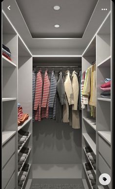 a walk in closet filled with lots of clothes