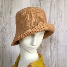 Crochet raffia hat It is a classic accessory for every woman for sun protection, summer parties, beach and travel. Can be a good gift for a woman of any age. The cap is crocheted from natural raffia, light, elastic, the brim of the cap is reinforced with wire. The hat keeps its shape well and does not fade in the sun. The cap is soft to the touch, slightly rough. It is fully crocheted. Easy to carry with foldable design. The hat is perfect for summer wardrobe. Field Size: about 3 inches Care of Casual Straw Sun Hat With Short Brim, Casual Paper Straw Hat For Warm Weather, Casual Wide Brim Hat In Paper Straw, Casual Wide Brim Paper Straw Hat, Lightweight Paper Straw Bucket Hat For Spring, Chic Brimmed Straw Bucket Hat, Chic Straw Brimmed Bucket Hat, Casual Lightweight Crochet Fedora Hat, Casual Lightweight Crochet Hat In Brown