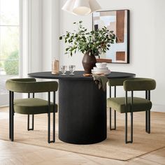 a dining room table with four chairs around it