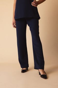 Catherine Regehr classic pull on pant in navy. 100% Silk Hi Rise Dry Clean Made in Canada Navy Bottoms For Business Casual With Straight Hem, Navy Business Casual Bottoms With Straight Hem, Navy Business Casual Pants With Straight Hem, Navy Straight Hem Pants For Business Casual, Navy Elegant Tapered Leg Dress Pants, Elegant Navy Tapered Leg Dress Pants, Navy Wide Leg Pants With Welt Pockets, Classic Navy Pants For Business Casual, Navy Wide Leg Formal Pants