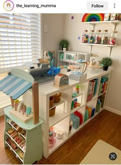 a child's playroom with shelves and toys