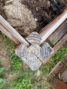 a piece of wood that has been cut in half and is sitting on the ground