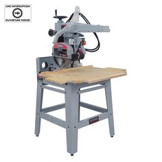 a table top sawing machine on a white background