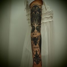 a woman's arm with tattoos on it