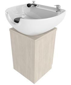 a white sink sitting on top of a wooden pedestal