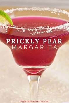 a close up of a drink in a glass with the words prickly pear margarita