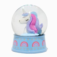 a snow globe with a pink and blue pony inside