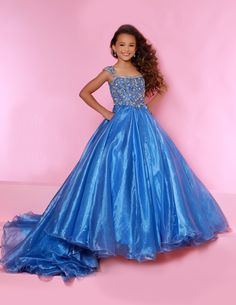 Sugar Kayne C146 Girls Pageant Dress. This lush pageant ballgown is made of flowy organza fabric. The top is embellished with semi sweetheart neckline and cap sleeves. Float on the stage in this full flowy pageant ballgown for girls and preteens. Colors: Turquoise, Orange Sizes: 2-16 (Sizes 2-6 do not have bust cups, Sizes 8-16 will have preteen size bust cups) Fabric: Organza, Mesh, Stretch Lining Baby Christening Outfit, Pageant Outfits, Johnathan Kayne, Girls Communion Dresses, Christening Outfit, Girls Pageant Dresses, Christening Dress, Christening Gowns, Pageant Dress