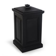 a black trash can sitting on top of a white floor