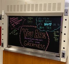 a blackboard with writing on it that says, you are greatness and not to worry