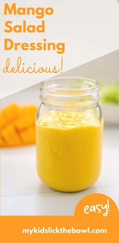 a jar filled with mango salad dressing on top of a table