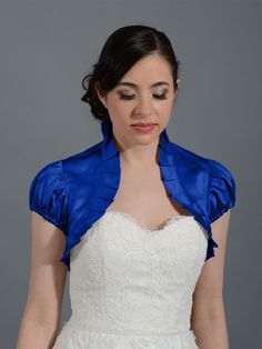 This is a blue puff short sleeve satin bolero jacket made of bridal satin with ruffled edges.Size small, medium, large and x-large are available. Small size normally fits US size 2-4; Medium size normally fits US size 6-8; Large size normally fits US size 10-12. x-Large size normally fits US... Wedding Dress Cover Up, Convertible Wedding Dresses, Wedding Dress Topper, Bolero Jacket Wedding, Lace Bolero Jacket, Short Sleeve Bolero, Dress Topper, Wedding Bolero, Bolero Wedding