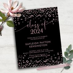 a black graduation party card with pink confetti