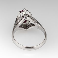 This fantastic ring centered with one (1) oval sapphire corundum that is four-prong set. Surrounding the center stone are six (6) round brilliant cut diamonds and ten (10) tapered baguette cut diamonds that are all prong set. The ring measures 15.1mm at the top, rises 8.9mm above the finger, tapering to 3.1mm wide and 1.0mm thick at the base of the shank. It is currently a size 5.75. Diamond Ballerina Ring, Ballerina Ring, Baguette Cut Diamond, Baguette Cut, Sapphire Diamond, Round Brilliant Cut Diamond, Brilliant Cut Diamond, Round Brilliant Cut, Pink Sapphire