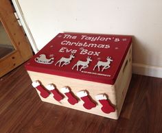 a wooden box with christmas decorations on it