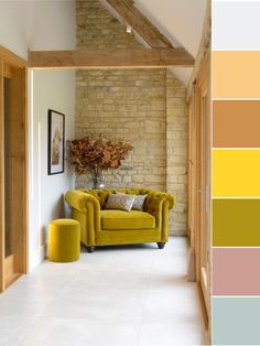 a living room filled with furniture next to a brick wall