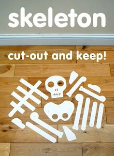 there is a sign on the floor that says skeleton cut out and keep it clean