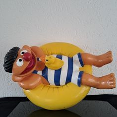 an inflatable balloon with a cartoon character floating on it