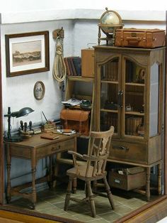 a miniature desk and chair in a room