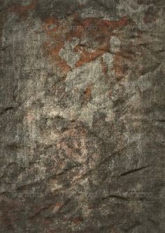 an old, dirty surface is shown in grey and brown tones with some red spots on it