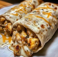 chicken enchilada wrapped in tortilla shells with melted cheese on top