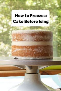 a cake sitting on top of a metal stand with the words how to freeze a cake before icing