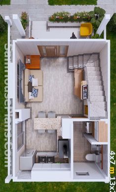 an overhead view of a small house with the kitchen and living room separated by stairs