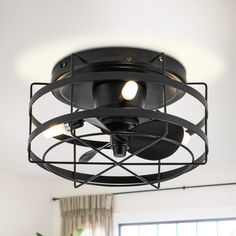 a black ceiling light with two lights on it