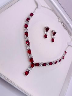 Elevate your special occasion with the exquisite Handmade Red Ruby Y-Shape Necklace & Dangle Earrings Set, a perfect blend of elegance and timeless beauty. This stunning jewelry set features a striking Y-shape necklace adorned with radiant red rubies and complementary dangle earrings, all designed with an enchanting infinity touch.  ❤️ The Allure of Red Ruby Red rubies are celebrated for their vivid color and deep symbolism, representing passion, love, and commitment. 🎁 Perfect for Bridesmaids, Elegant Jewelry Sets For Valentine's Day Formal, Red Sterling Silver Party Jewelry Sets, Red Sterling Silver Jewelry Sets For Party, Red Gemstone Sterling Silver Jewelry Sets, Red Gemstone Jewelry Sets In Sterling Silver, Red Sterling Silver Jewelry Sets For Anniversary, Elegant Red Jewelry Sets For Formal Occasions, Red Sterling Silver Jewelry Sets For Wedding, Red Sterling Silver Wedding Jewelry Sets