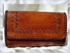 Women's leather bag or clutch- hand embossed and handmade. India is known the world over for its quality leather products and is the second largest producer of leather products in the world. Some of the fashion brands across the world that source their leather products from India are: Armani, Coach, Guess, Harrods, Hush Puppies, Kenneth Cole, Liz Claiborne, Marks & Spencer, Nautica, Next, Nike, Cole Haan, Pierre Cardin, Prada, Reebok, Salamander, Tommy Hilfiger, Versace, Yves St. Laurent, Za Brown Leather Handbag, St Laurent, Brown Leather Handbags, Honey Brown, Leather Products, Leather Bag Women, Hush Puppies, Pierre Cardin, Textile Fabrics