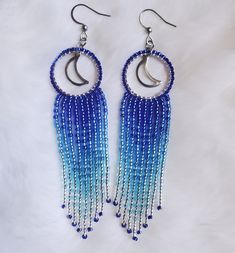 blue and white beaded earrings with crescents