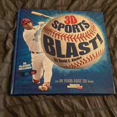 the 3d sports blast book is laying on a bed with its cover pulled back to reveal an image of a baseball player