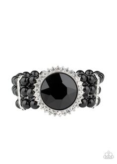 Threaded along stretchy bands, strands of polished black beads are held in place with white rhinestone encrusted fittings around the wrist. Bedazzled in a ring of glassy white rhinestones, a dramatically oversized black gem adorns the center for a speechless finish. Sold as one individual bracelet. P9ST-BKXX-009XX Sparkle Bracelet, Black Gems, Faceted Gems, Bracelet Online, Paparazzi Accessories, Band Bracelet, Black Bracelets, White Rhinestone, Paparazzi Jewelry