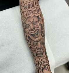 a person with a tattoo on their arm that says good times and a joker mask