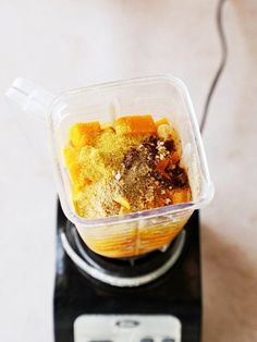 a blender filled with food on top of a counter