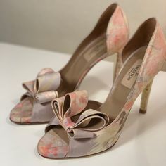 You’re Not Gonna Find The Shoes Anywhere. The Signature Bow D’orsay Scylla Wet In A Pale Pastel Yellow Gray And Pink Fabric That Looks Almost Like A Watercolor Type Of Fabric In Silk. Brand New Tips. Valentino Collectors Item For Those Who Know. Fits True To Size. No Box Or Dust Bag Designer 4-inch Heels For Spring, Spring Gala Ankle Strap Heels, Feminine Open Heel Formal Heels, Feminine Wedding Shoes For Formal Occasions, Spring Gala Heels With Wrapped Heel, Spring Gala Pointed Toe Heels, Spring Gala Wrapped Heel Shoes, Spring Gala Wedding Shoes With Heel Strap, Spring Luxury Wedding Shoes