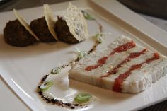 a white plate topped with food on top of a table