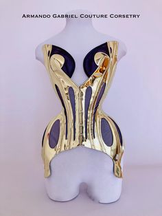 This mirror gold corset, inspired by butterfly wings is a unique piece that will bring life to any fantasy ball gown or costume. Whether used in a show or to cause a show, this piece will dazzle. You will feel like a powerful goddess in this corset!