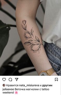 a woman's arm with a flower tattoo on the left side of her arm