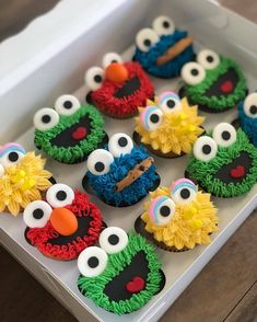 the cupcakes are decorated like sesame street characters