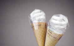 two ice cream cones wrapped in plastic wrap