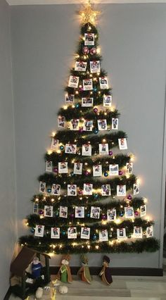 a decorated christmas tree with pictures on it