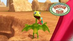 a cartoon character is standing in front of a red curtain with the words dinosaur train on it