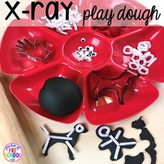 an x - ray play dough tray with scissors and other items