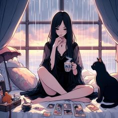 a woman sitting on a bed next to a black cat and holding a coffee cup