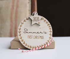 a wooden ornament that says summer's first christmas with a star on it