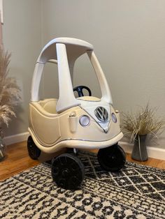 a toy car sitting on top of a rug